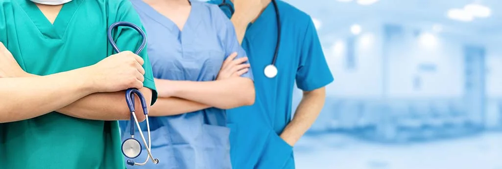Doctor and nurses - ready to support breast augmentation patient