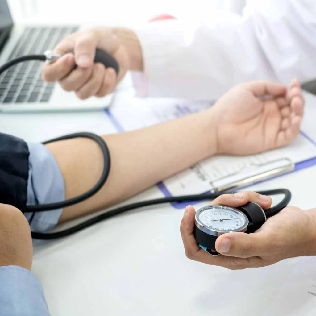Day of Surgery- Nurse taking blood pressure of patient